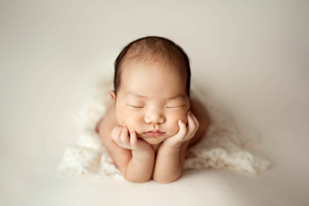 Sleeping baby in froggy pose in Olney, MD in-home newborn photography session