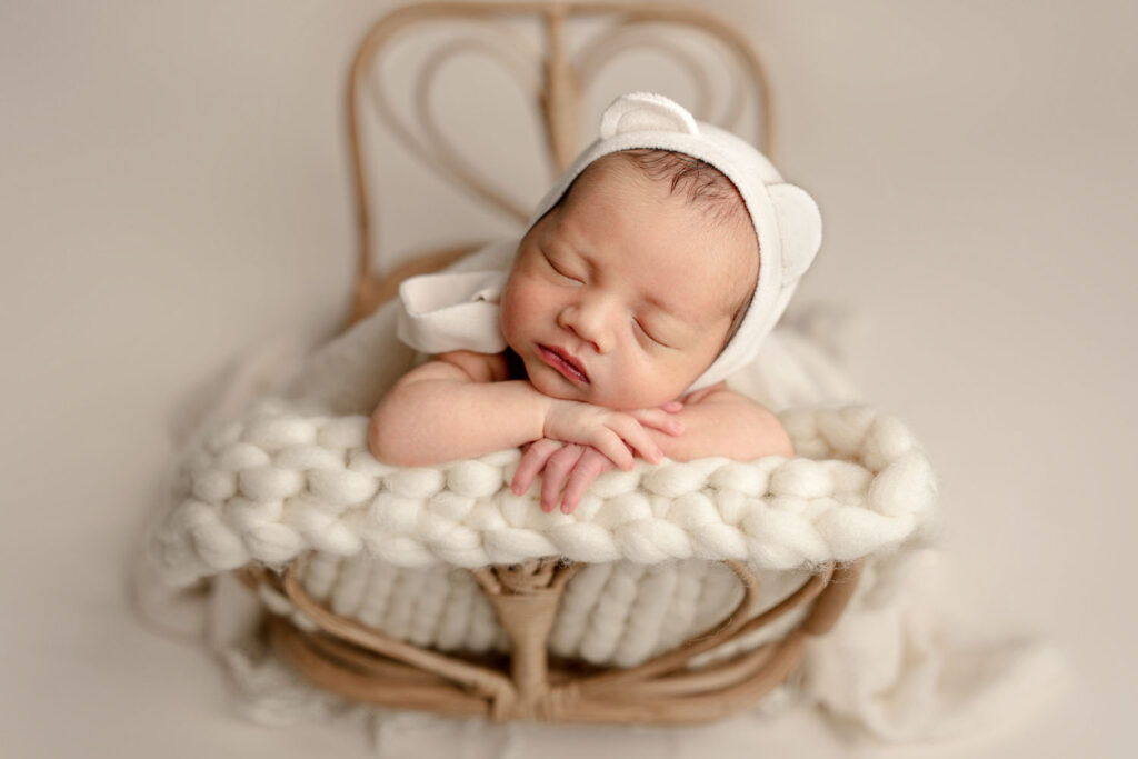 Baby posed on a heart bed