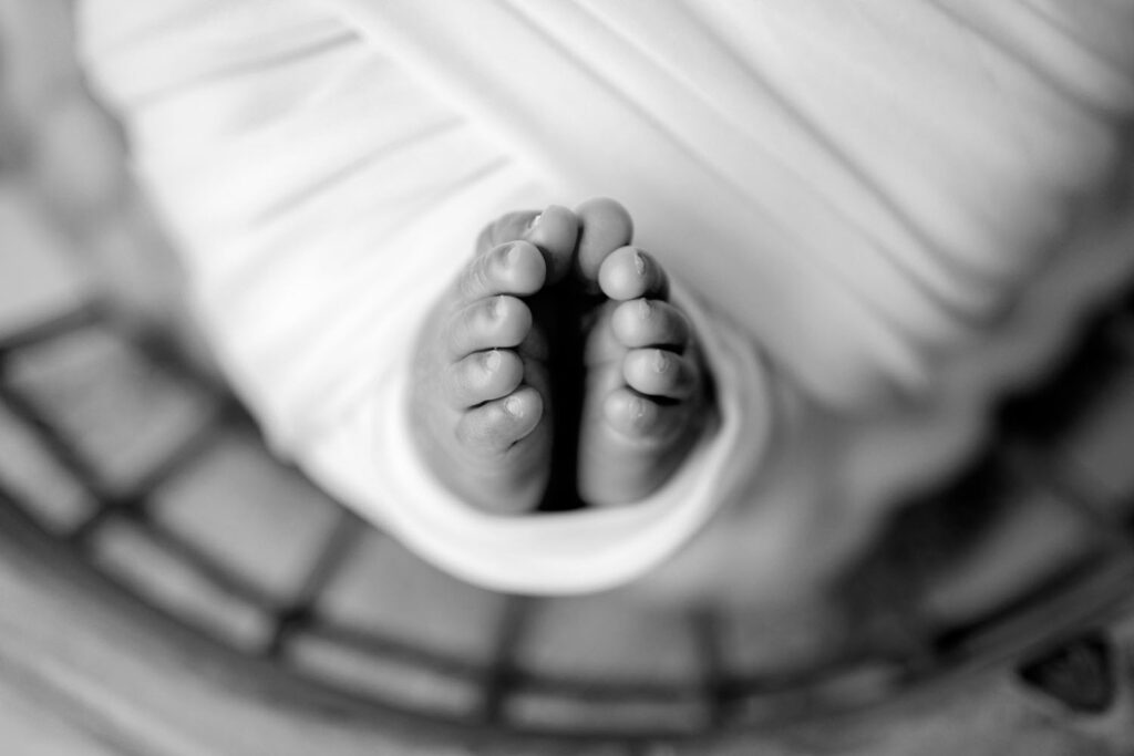 black and white image of baby's toes