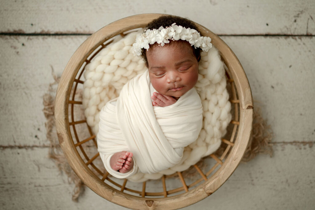 Baby wrapped with toes showing during her in-home photo session